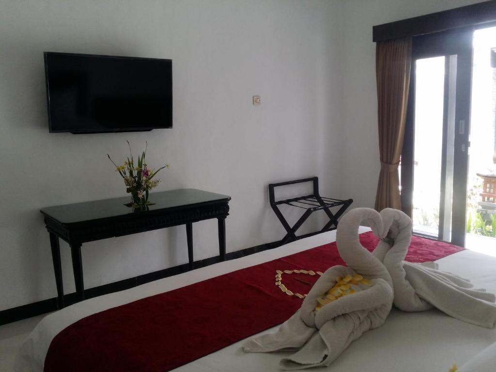 TV a/nebo společenská místnost v ubytování Palm Bamboo Hotel