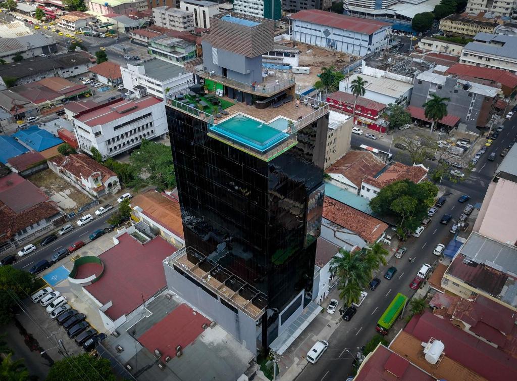 an overhead view of a city with a tall building at Innfiniti Hotel & Suites in Panama City