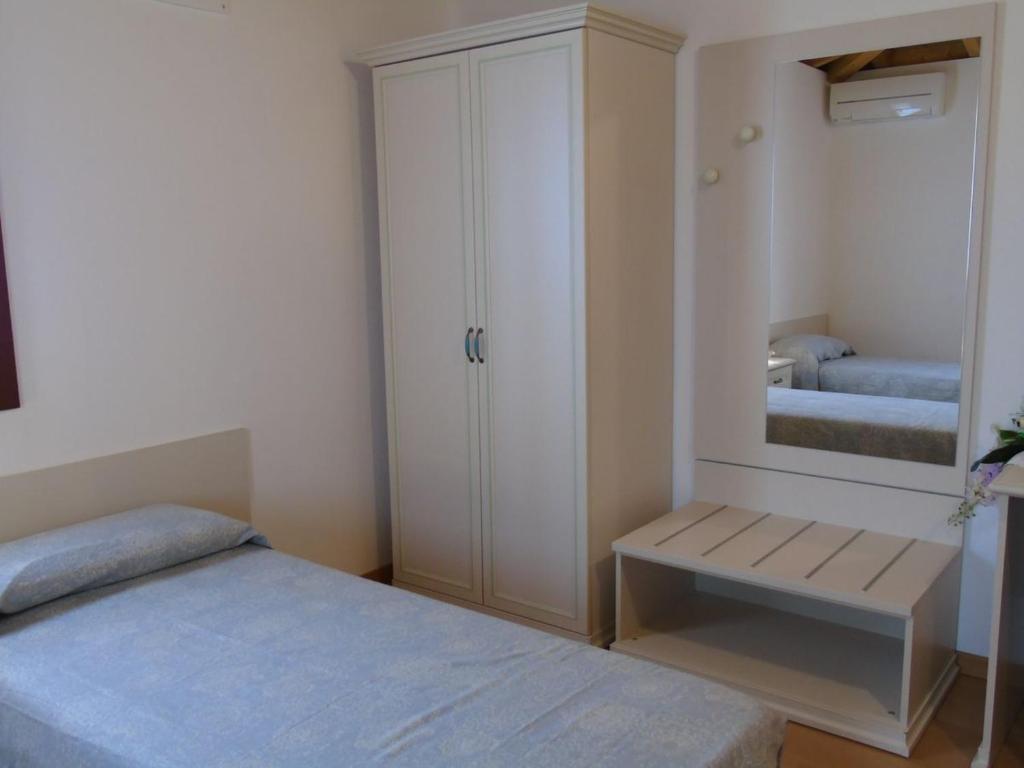 Postel nebo postele na pokoji v ubytování B&B Ai Cipressi