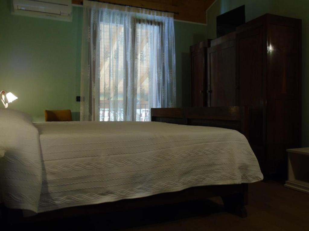 Postel nebo postele na pokoji v ubytování B&B Ai Cipressi