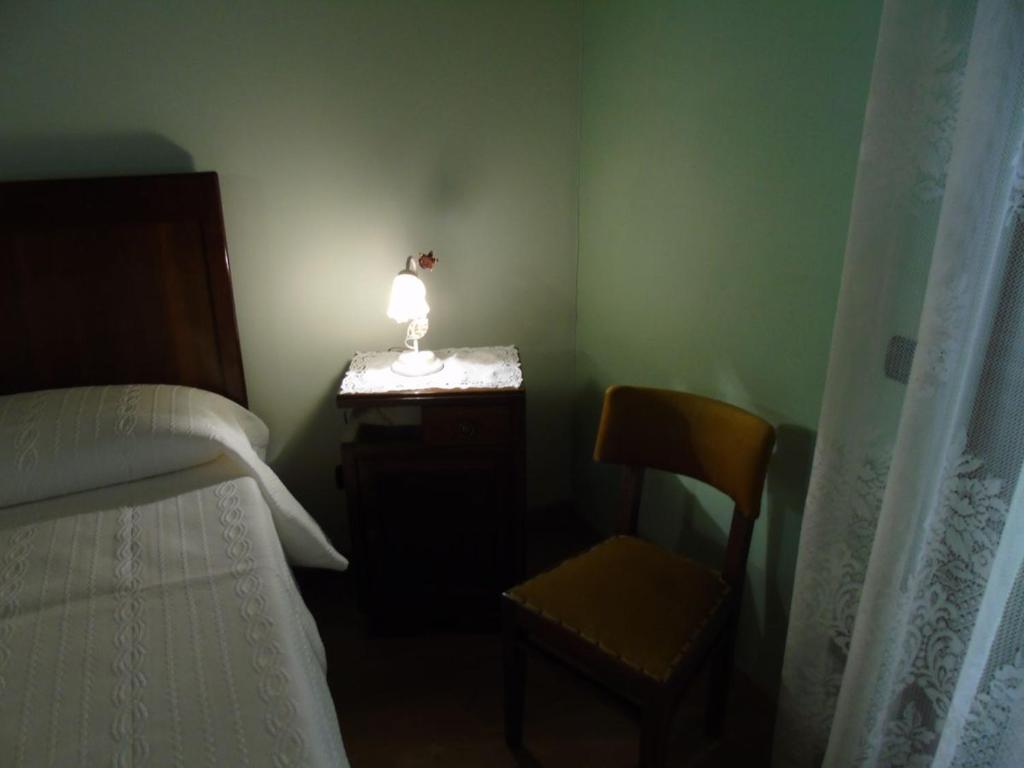 Postel nebo postele na pokoji v ubytování B&B Ai Cipressi