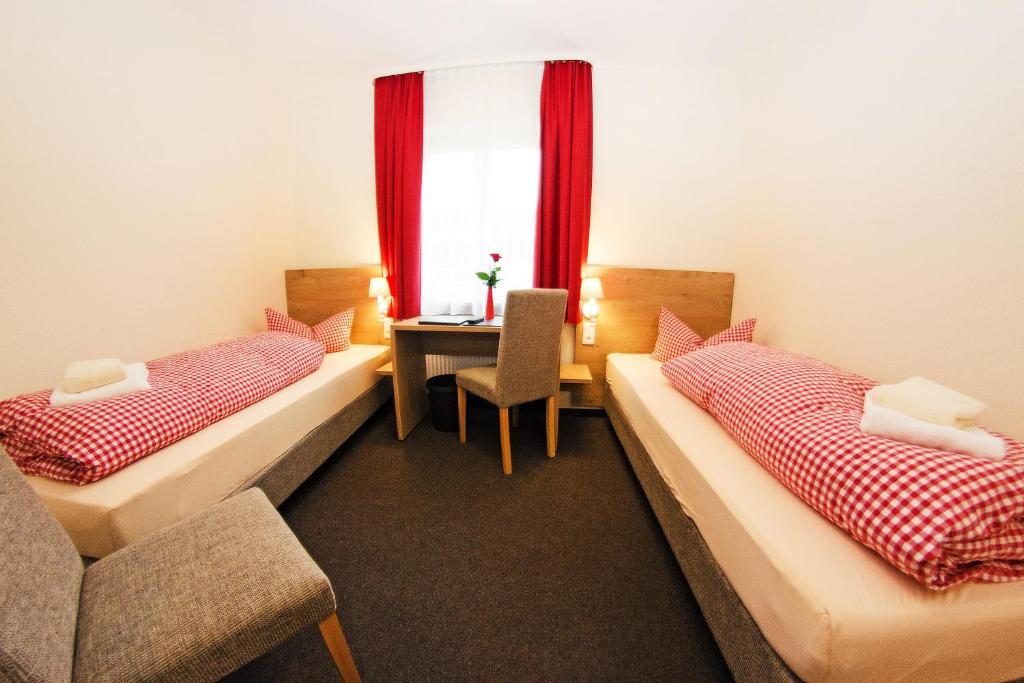 Postel nebo postele na pokoji v ubytování Braugasthof Trompete