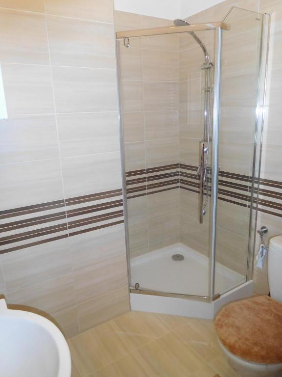 Kúpeľňa v ubytovaní Apartament DERUBEIS