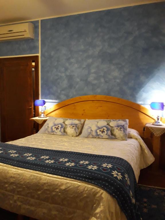 Een bed of bedden in een kamer bij Barone Rosso