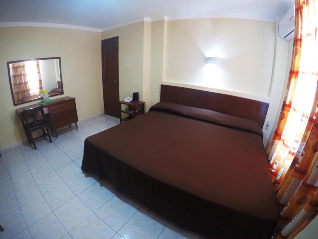 Postel nebo postele na pokoji v ubytování Hotel Oriente