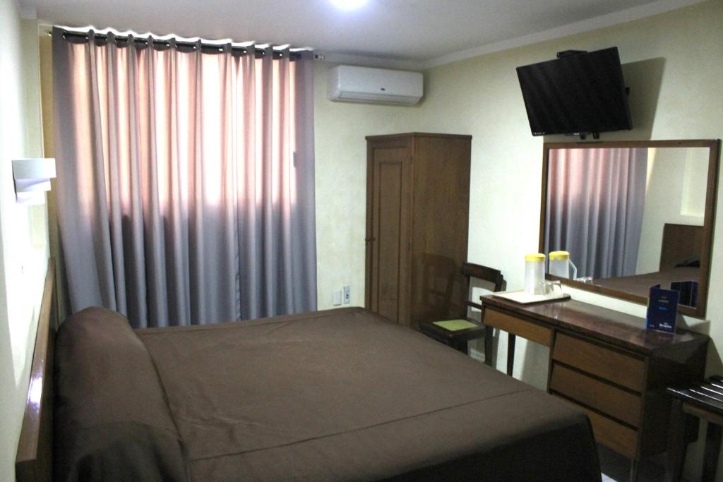 Postel nebo postele na pokoji v ubytování Hotel Oriente