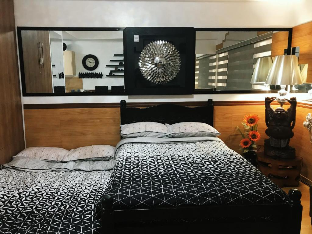 Tempat tidur dalam kamar di Condotel