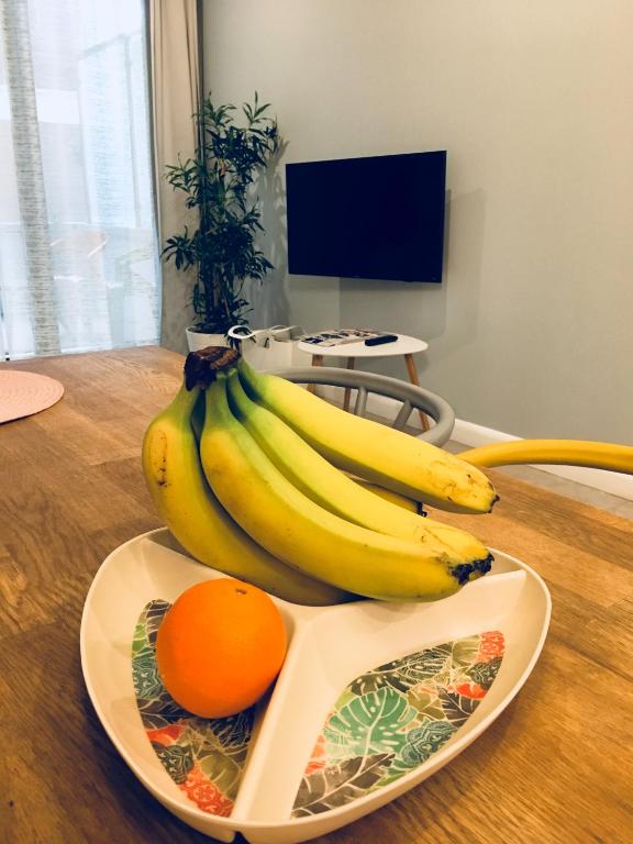 Televízia a/alebo spoločenská miestnosť v ubytovaní Piper Cytadela Apartament