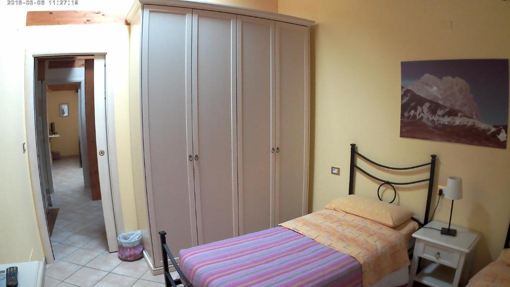 Postel nebo postele na pokoji v ubytování La Casetta Di Atri