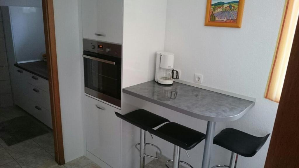 Kuchyňa alebo kuchynka v ubytovaní Apartments Varos