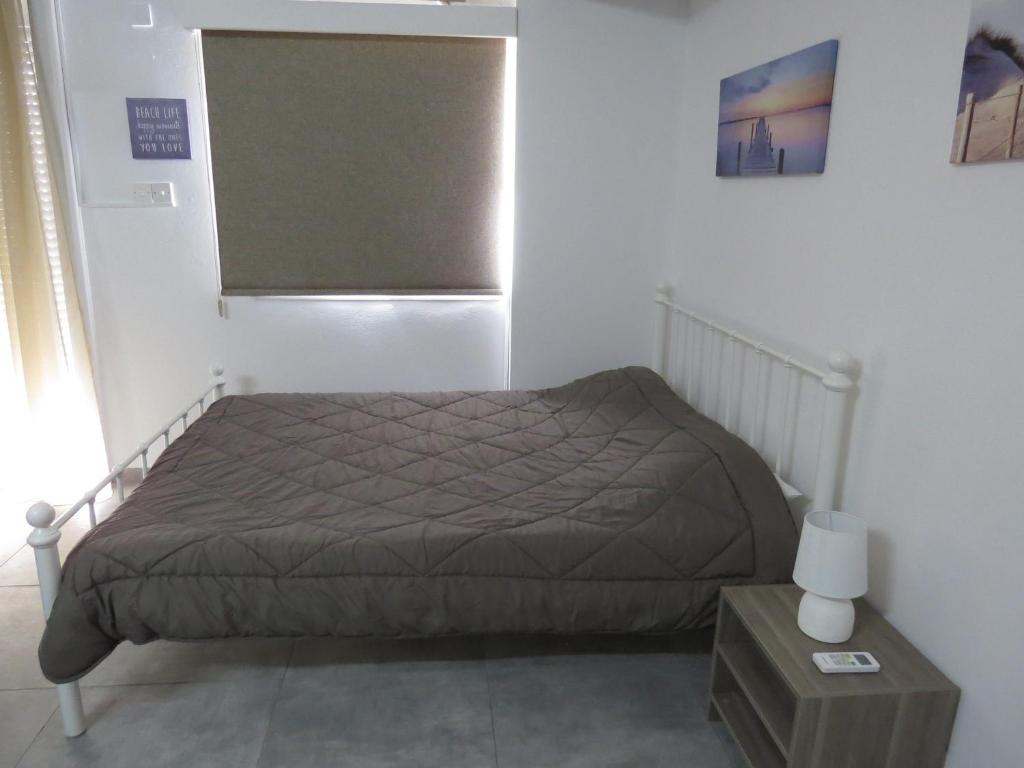 Postel nebo postele na pokoji v ubytování Adonis Apartment