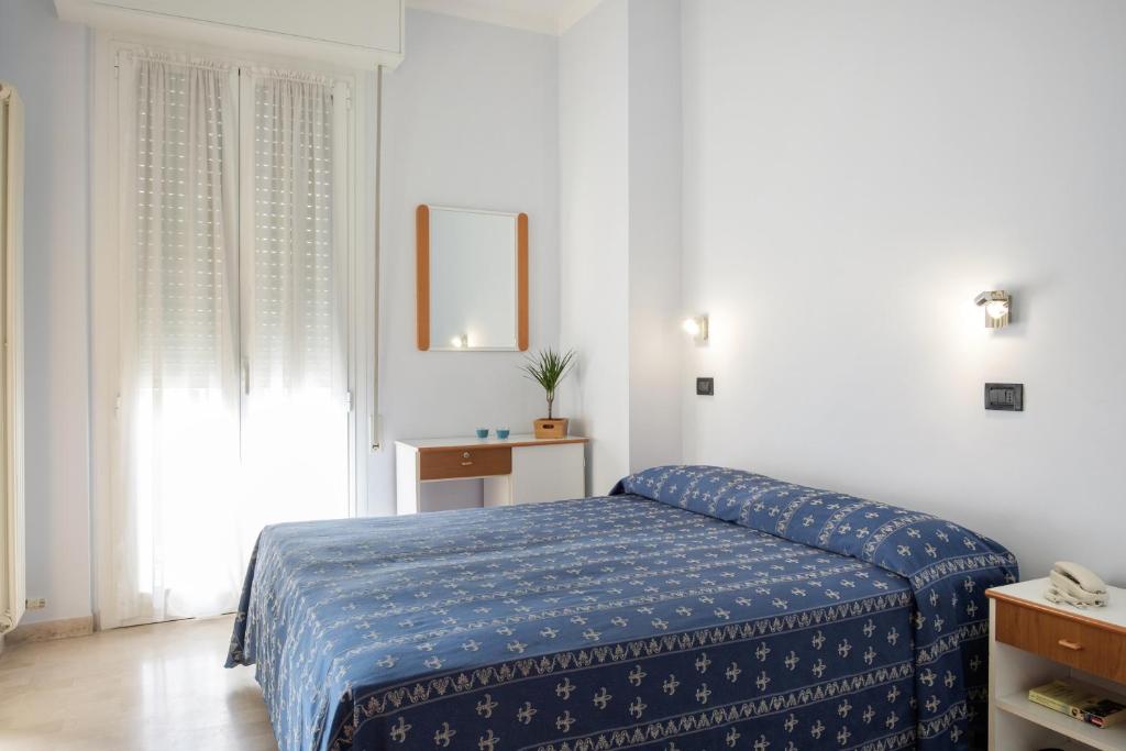 Postel nebo postele na pokoji v ubytování Hotel Kadett