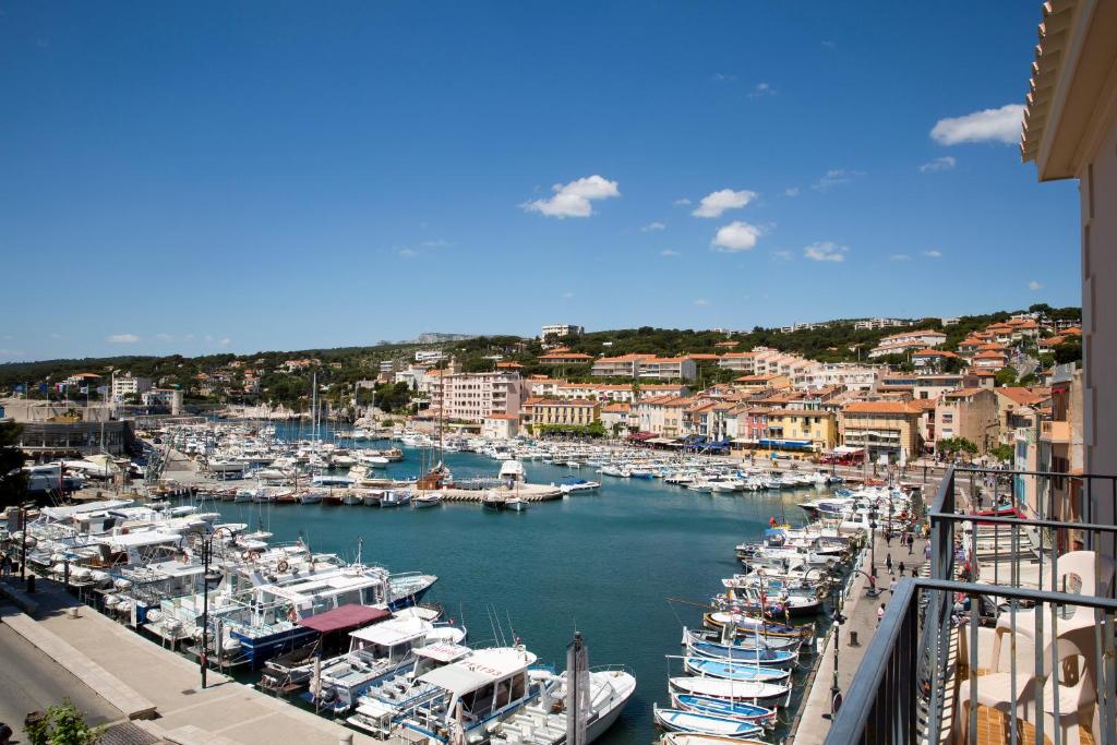 a group of boats docked in a harbor at Hôtel Liautaud Rooftop Cassis in Cassis