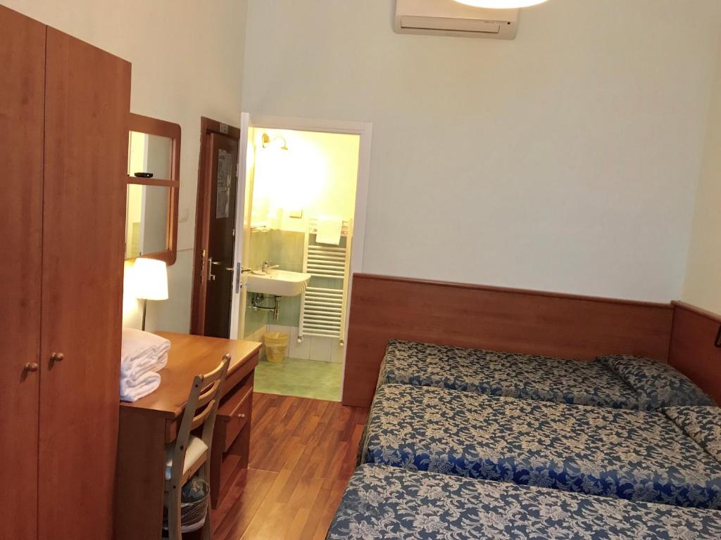 Postel nebo postele na pokoji v ubytování Hotel Romagna