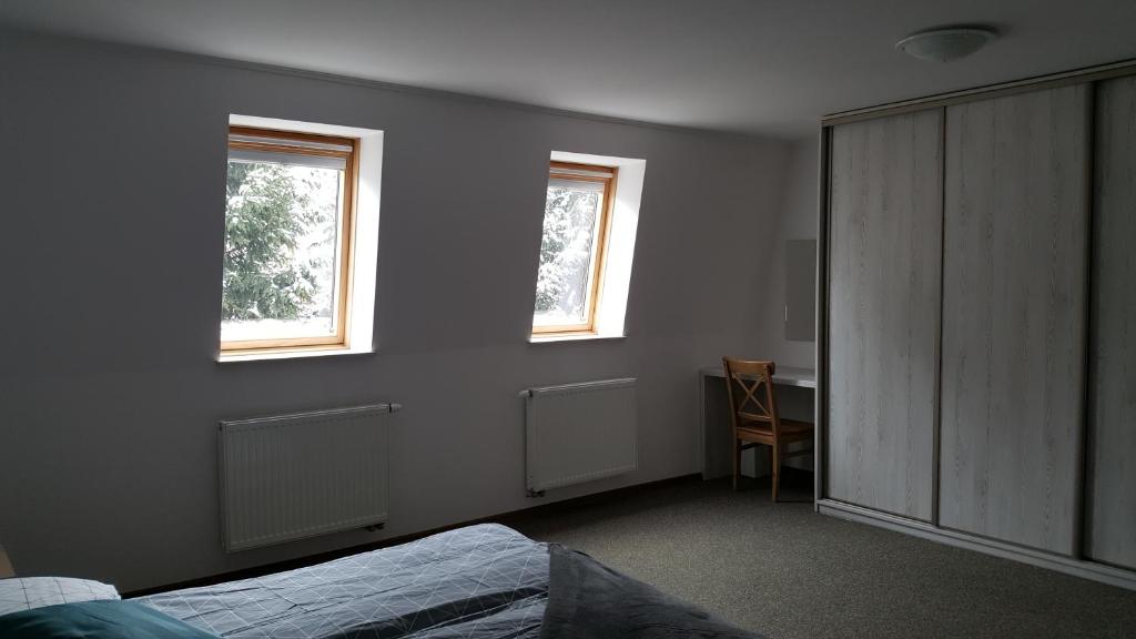 Posteľ alebo postele v izbe v ubytovaní Apartament rodzinny z ogrodem - Bliżej Zdroju