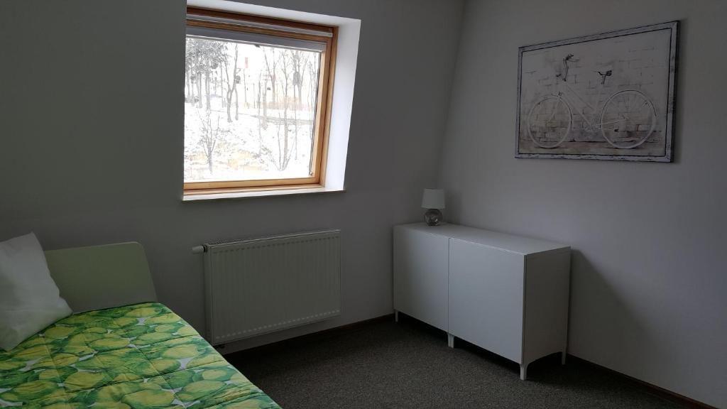 Posteľ alebo postele v izbe v ubytovaní Apartament rodzinny z ogrodem - Bliżej Zdroju