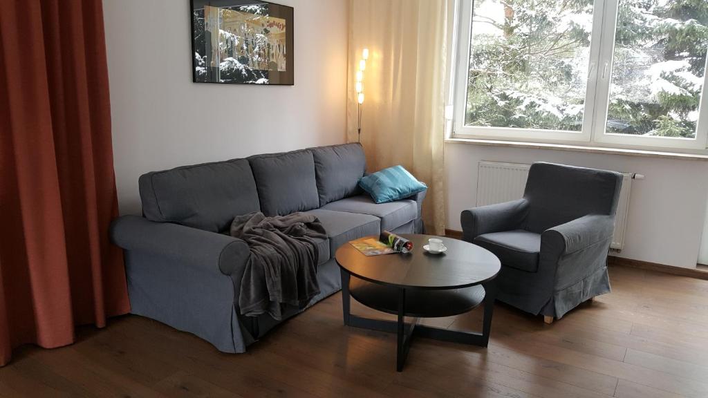Posedenie v ubytovaní Apartament rodzinny z ogrodem - Bliżej Zdroju