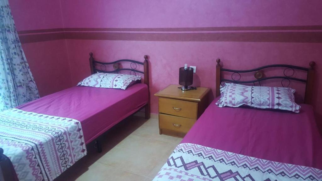 Postel nebo postele na pokoji v ubytování magnifique appartement Saidia wifi gratuit et chaînes internationales