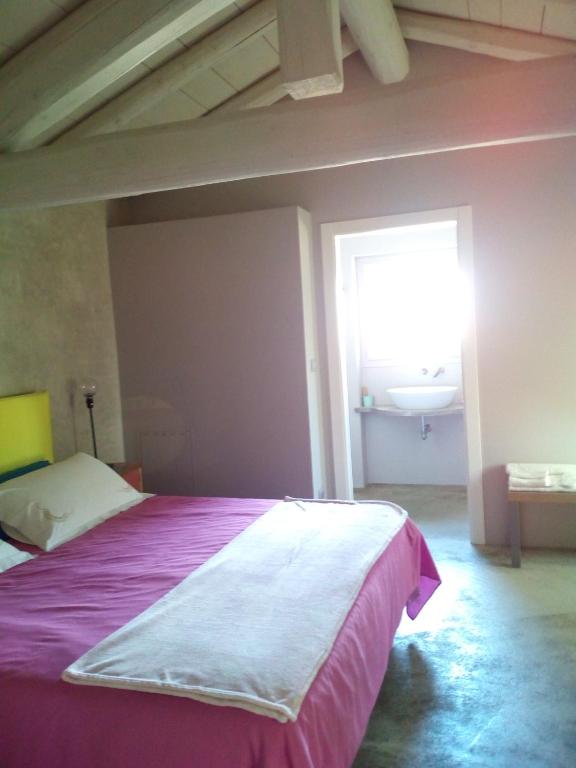 Postel nebo postele na pokoji v ubytování Casa Torre Allera
