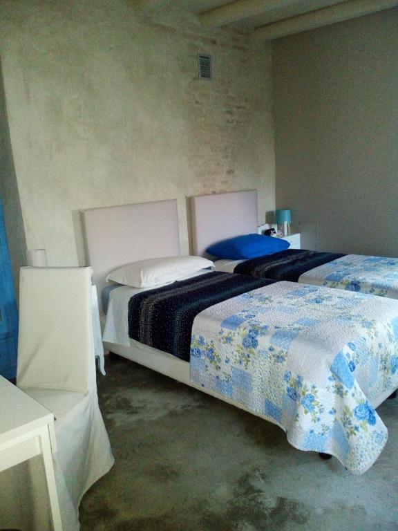 Postel nebo postele na pokoji v ubytování Casa Torre Allera