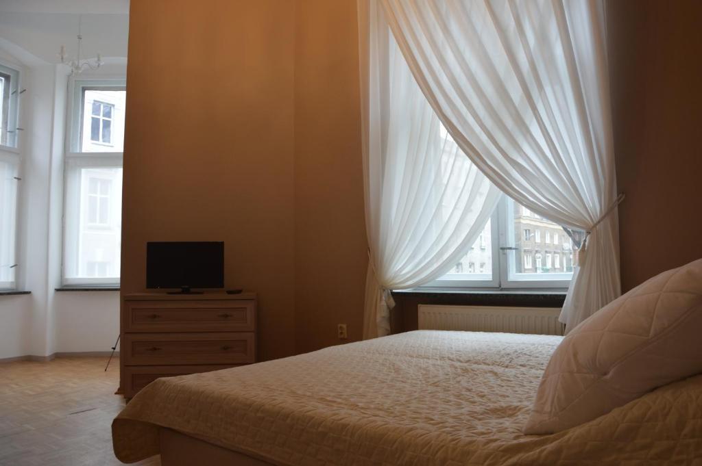 TV a/nebo společenská místnost v ubytování Ada Aparthouse