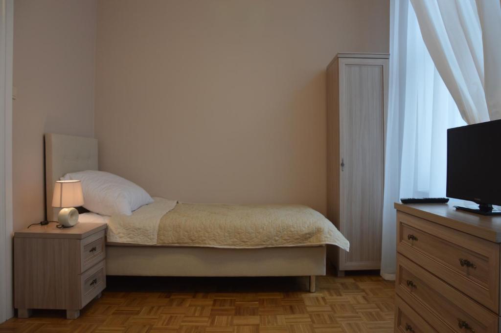 Postel nebo postele na pokoji v ubytování Ada Aparthouse