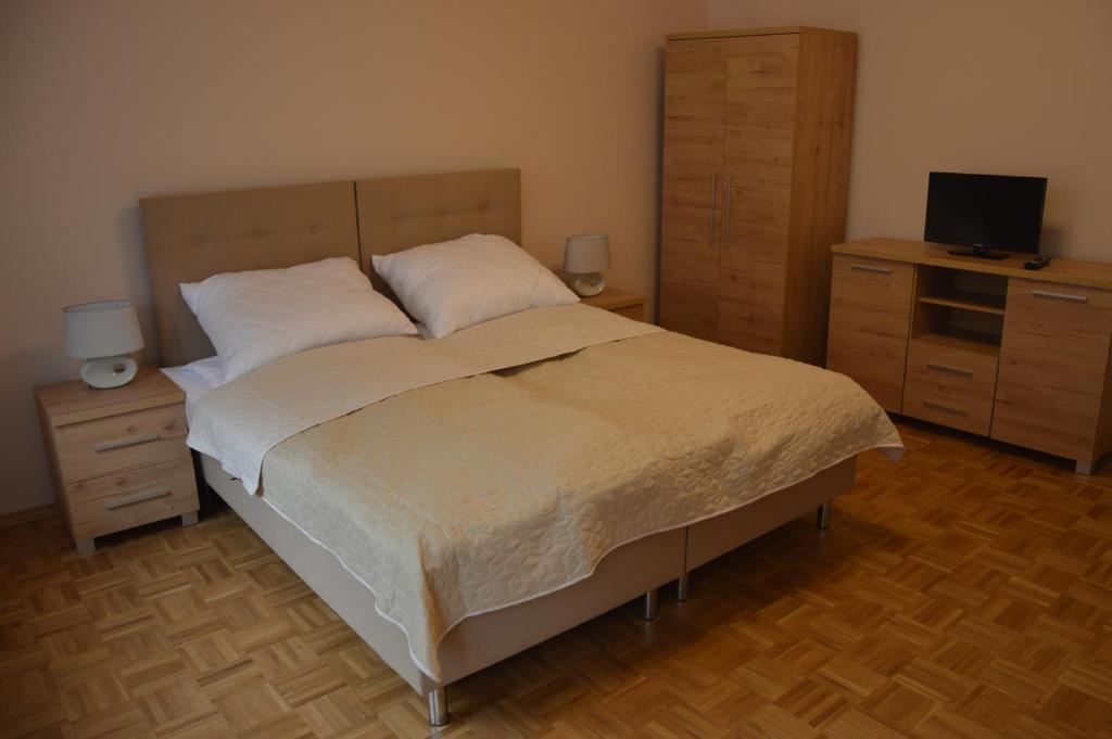 Postel nebo postele na pokoji v ubytování Ada Aparthouse