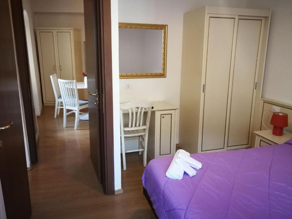 Postel nebo postele na pokoji v ubytování Hotel La Zorza