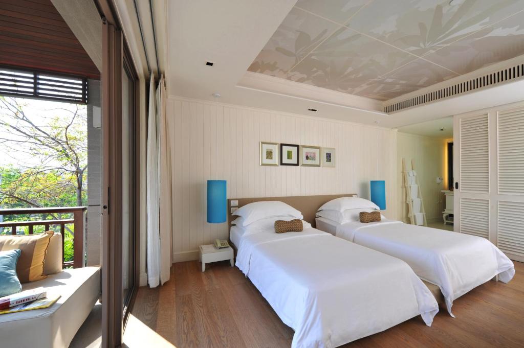 Postel nebo postele na pokoji v ubytování Rest Detail Hotel Hua Hin