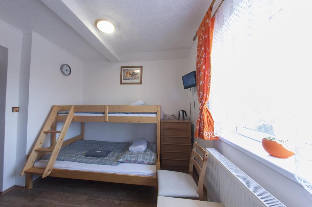 Postel nebo postele na pokoji v ubytování Penzion "U Nádraží"