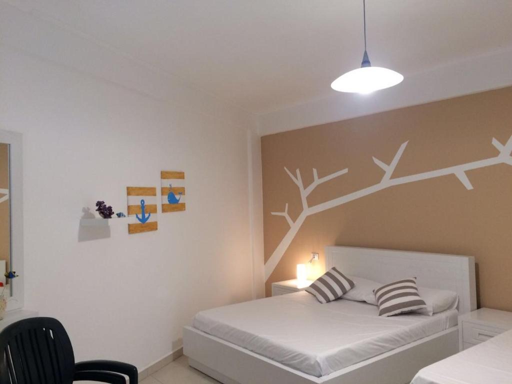 Llit o llits en una habitació de Aldi`s Guest House