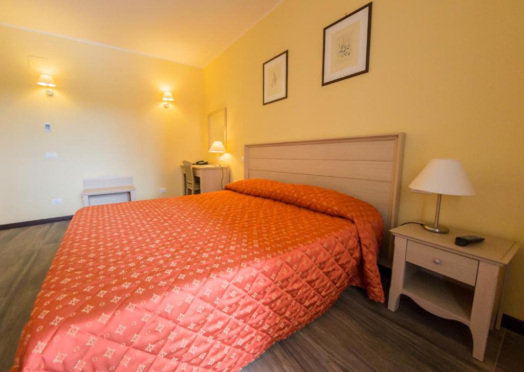 Postel nebo postele na pokoji v ubytování Il Parco Sul Mare Resort & SPA