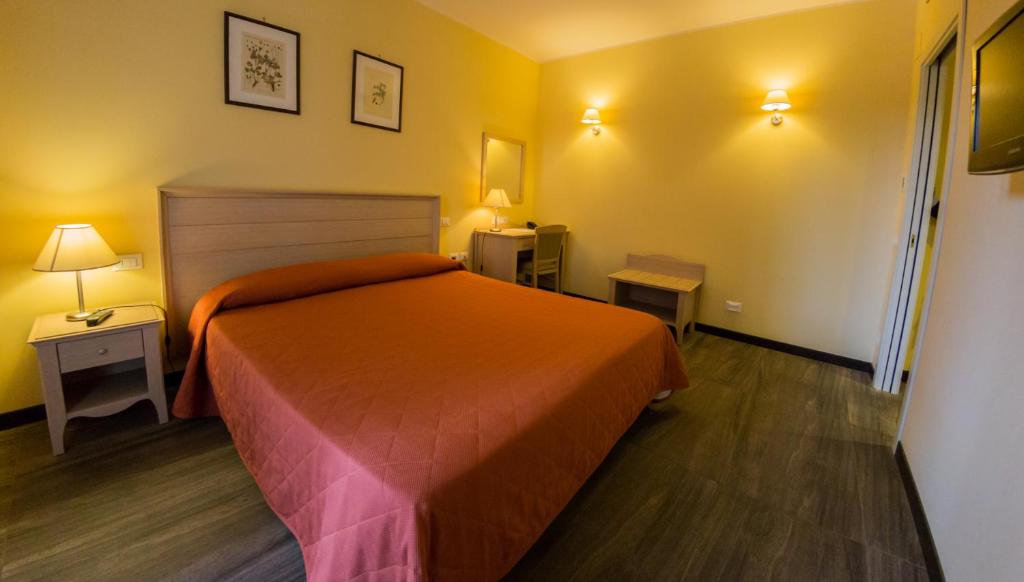 Postel nebo postele na pokoji v ubytování Il Parco Sul Mare Resort & SPA