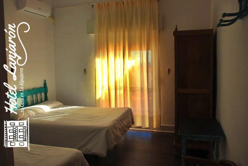 Posteľ alebo postele v izbe v ubytovaní Hotel Lanjaron