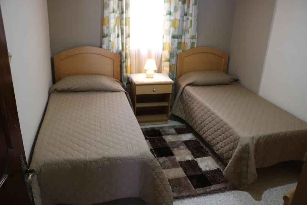 Postel nebo postele na pokoji v ubytování Sea front apartment