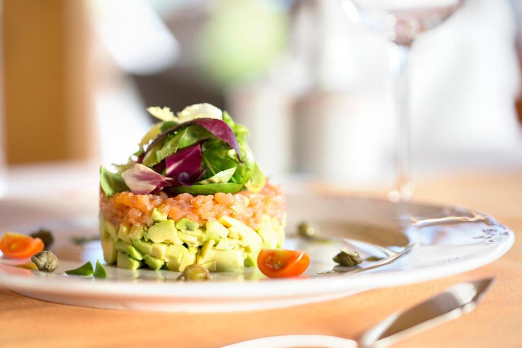 a plate of food on a table at Hipotels Playa La Barrosa - Adults Only in Chiclana de la Frontera