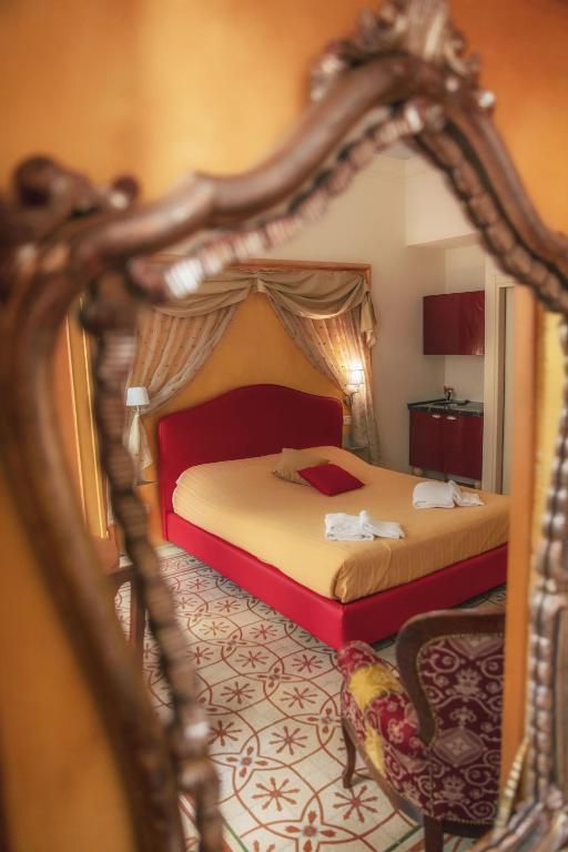 Posteľ alebo postele v izbe v ubytovaní Ghibellino B&B