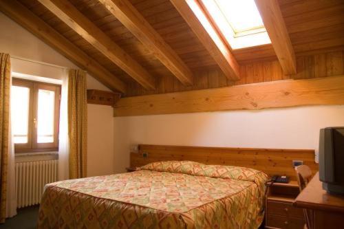 Postel nebo postele na pokoji v ubytování Hotel Beau Site