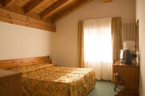 Postel nebo postele na pokoji v ubytování Hotel Beau Site