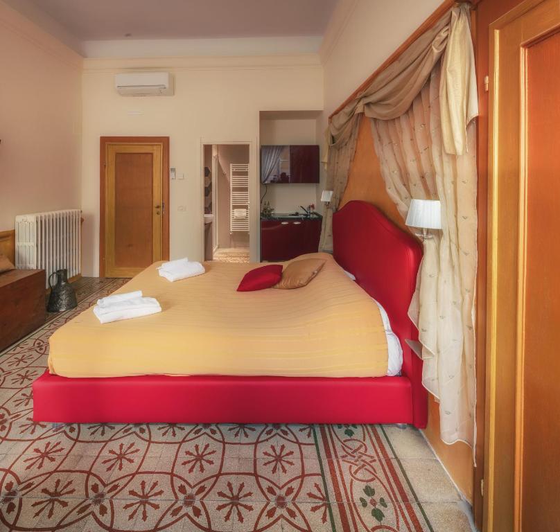 Posteľ alebo postele v izbe v ubytovaní Ghibellino B&B
