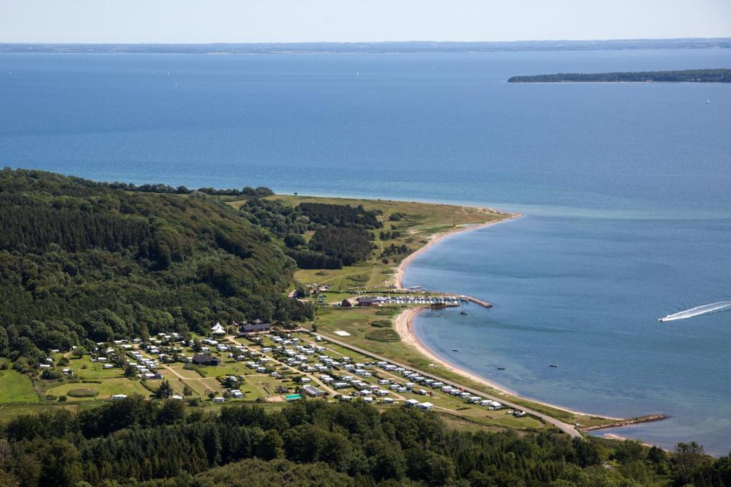 an aerial view of a parking lot next to the water at Rosenvold Strand Camping in Stouby