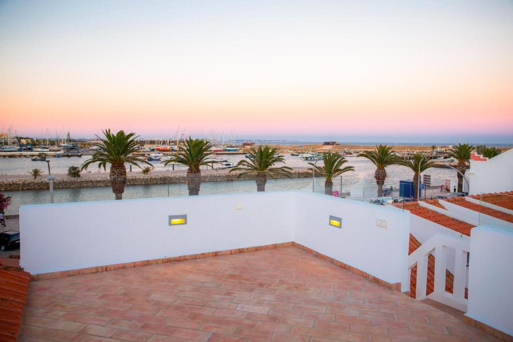 a view of the beach from the roof of a building at Casa Portas de Portugal – Comfort in Lagos in Lagos