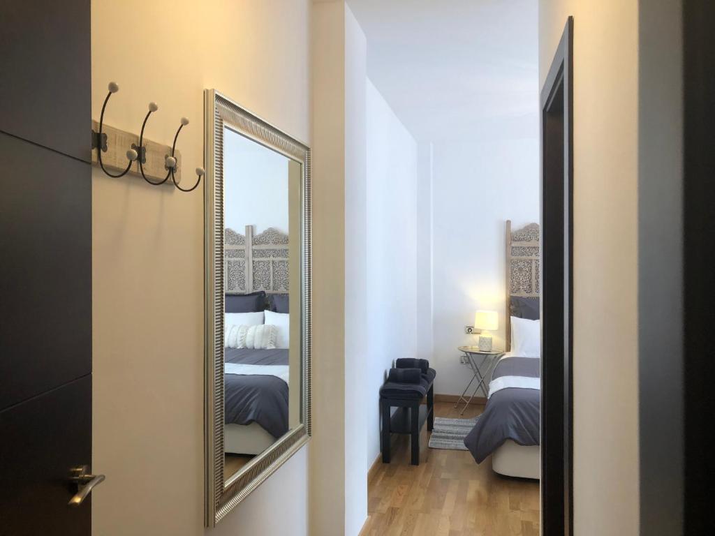 A bed or beds in a room at MALAGAJARA 61