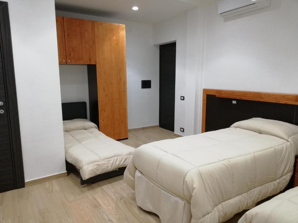 Łóżko lub łóżka w pokoju w obiekcie B&B Controtempo
