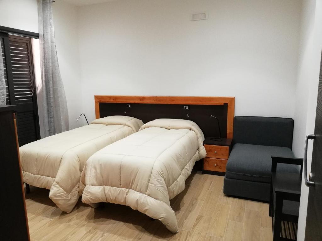 Łóżko lub łóżka w pokoju w obiekcie B&B Controtempo