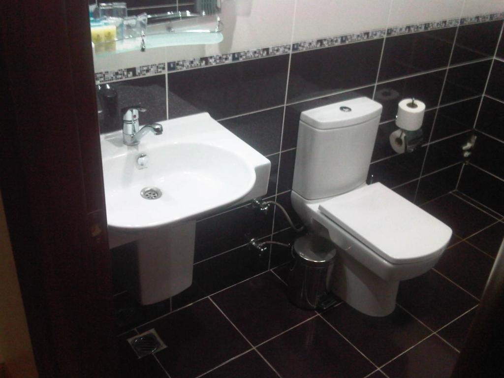 Koupelna v ubytování Basileus Hotel