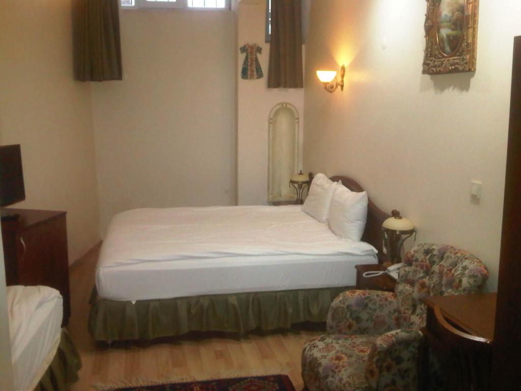 Postel nebo postele na pokoji v ubytování Basileus Hotel