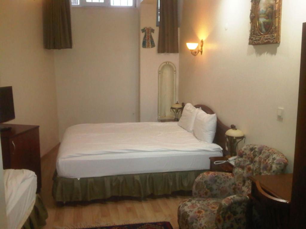 Postel nebo postele na pokoji v ubytování Basileus Hotel