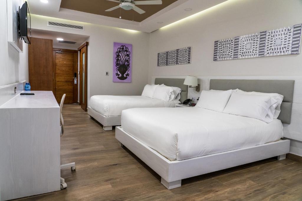 Postel nebo postele na pokoji v ubytování Satama Hotel