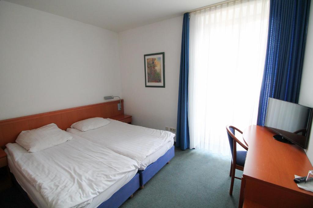 Postel nebo postele na pokoji v ubytování Hotel Ahrberg Viertel